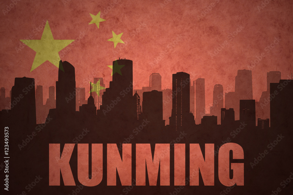 abstract silhouette of the city with text Kunming at the vintage chinese flag background
