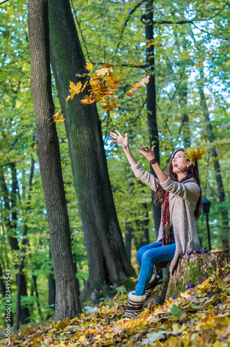 smiling, happy girl drop up the leaves