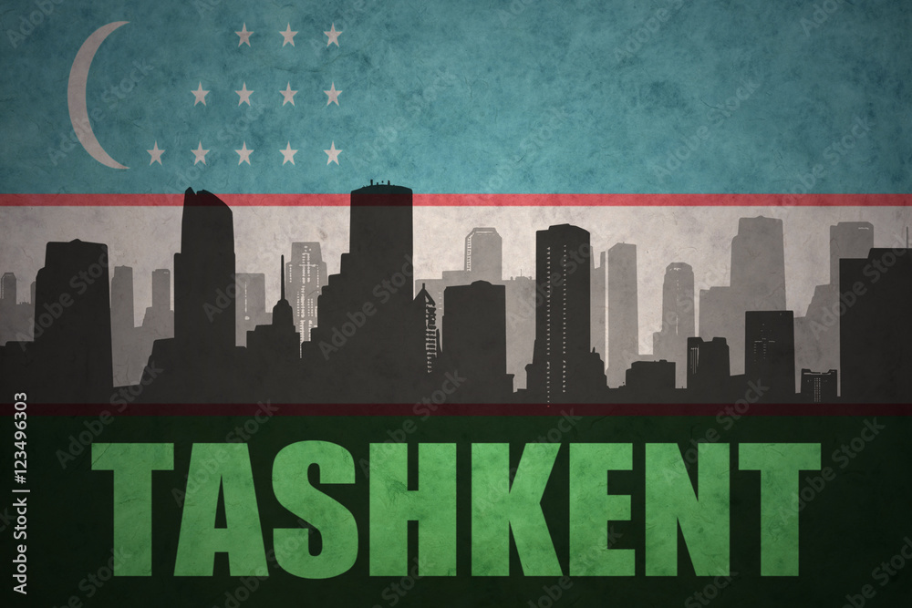 abstract silhouette of the city with text Tashkent at the vintage uzbekistan flag background