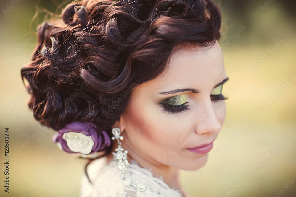 Wedding portrait of bride. Creative hairstyle and colorful makeup. Bride portrait. Soft selective focus