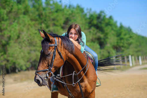 girl astride a horse © Tortuga