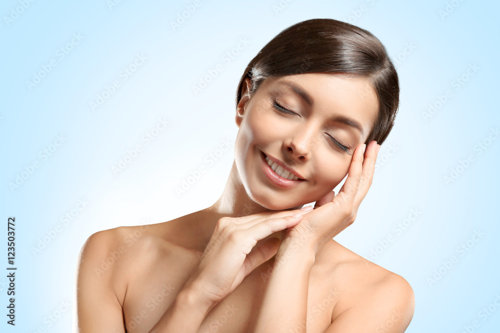 Young beautiful woman on light background Young beautiful woman on light background