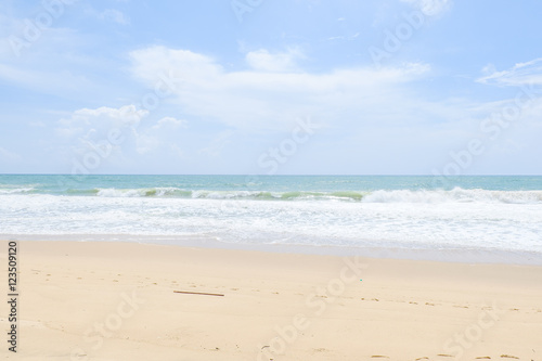 Empty sandy beach with sea under blue sky in thailand © sgaphotos