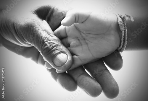Hand man holding hand baby black and white picture. concept idea.