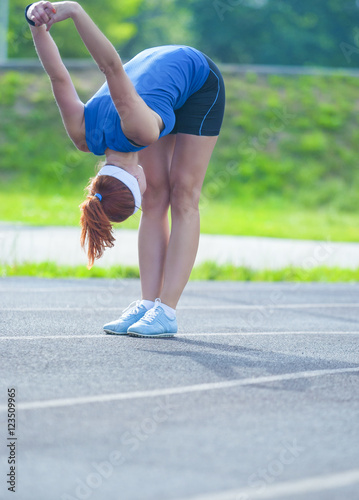 Female Caucasian Athlete During Her Warming-up Training Outdoors