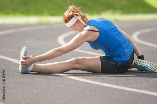 Sport and Athletics Concepts and Ideas. Caucasian Female Sportswoman Exercising Outdoors photo