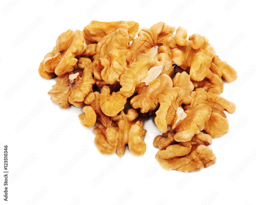 Heap of fresh shelled walnuts on white background. Close-up. Heap of fresh shelled walnuts on white background. Close-up.