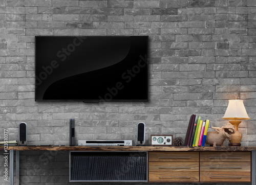 Tv on brick wall with wooden table media furniture