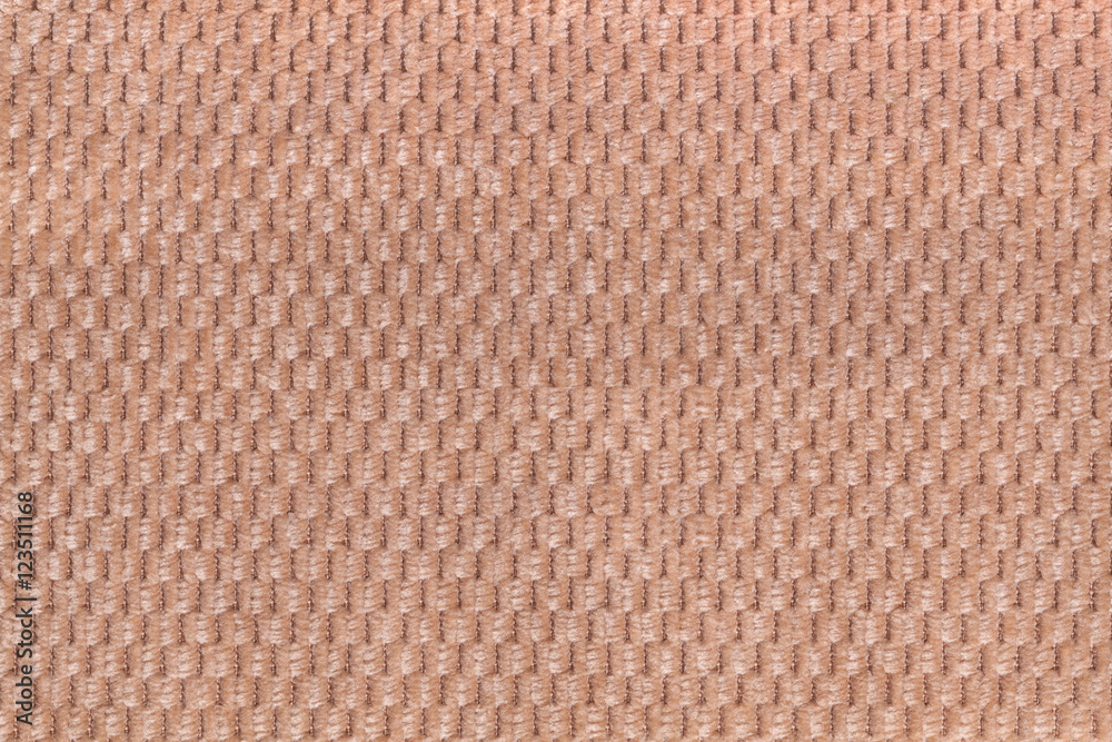 Light brown background from soft fleecy fabric closeup. Texture of textile macro. Light brown background from soft fleecy fabric closeup. Texture of textile macro.