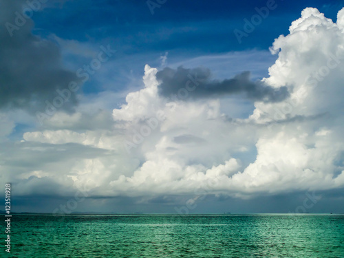 white cloud and emeral sea