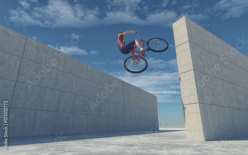 Young cyclist jumping photo