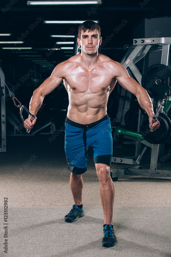 handsome bodybuilder works out pushing up excercise in gym handsome bodybuilder works out pushing up excercise in gym