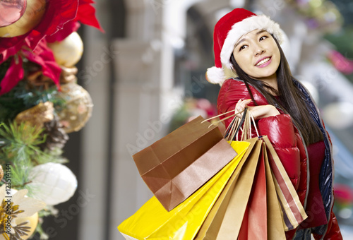 young asian woman shopping for christmas
