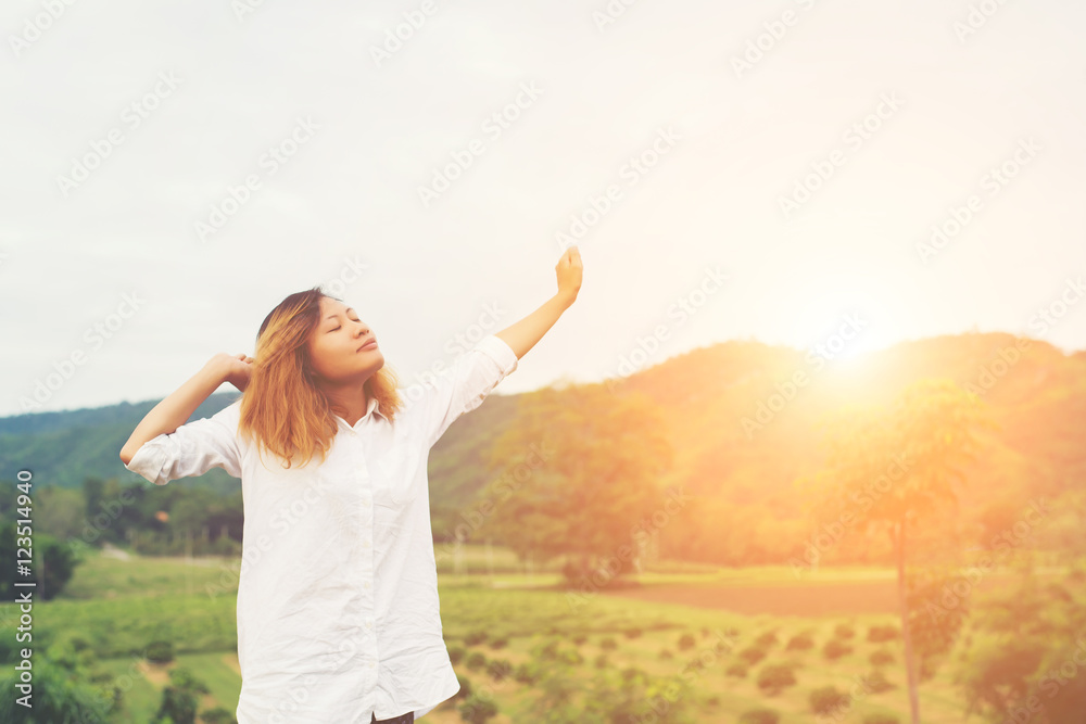 Beautiful women standing raising arm after waking, enjoy with fr Beautiful women standing raising arm after waking, enjoy with fr
