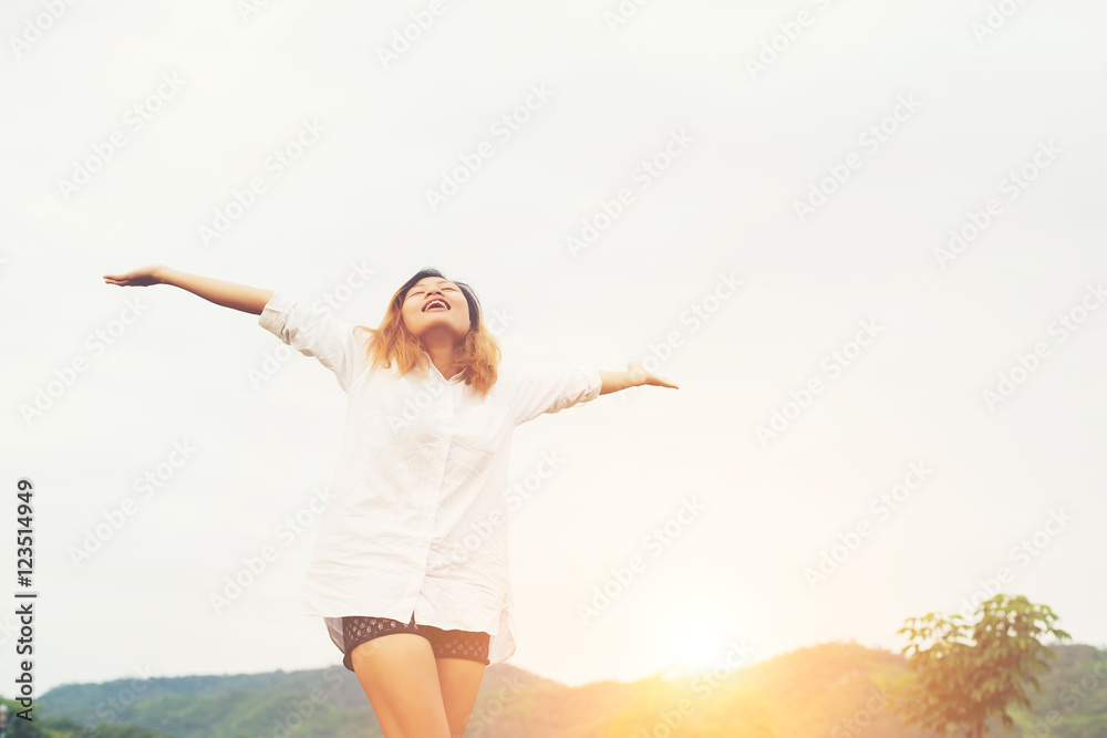 Beautiful women standing raising arm after waking, enjoy with fr Beautiful women standing raising arm after waking, enjoy with fr