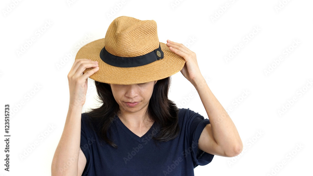Casual South East Asian girl wearing hat hiding her upset emotio