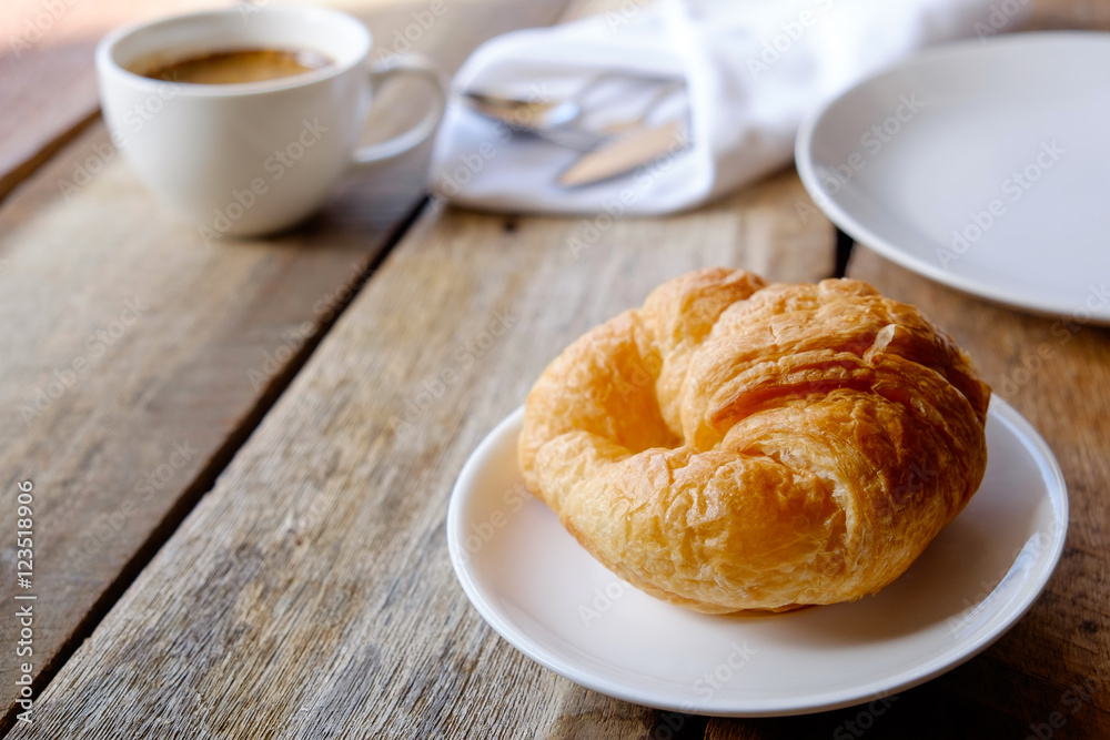 breakfast with croissants, cup of coffee.