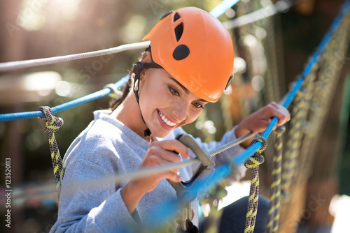 Принти на полотні Good looking careful woman checking the carabiner