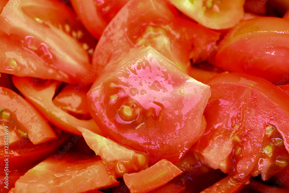 Cutting slices of red tomatoes, randomly scattered. Cutting slices of red tomatoes, randomly scattered.