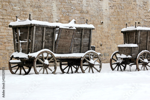 The old wooden carts in the snow