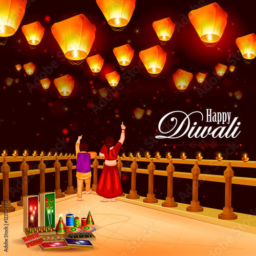 Kid pointing sky lamp with cracker for Happy Diwali