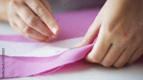 Wallpaper Mural woman with pins stitching paper pattern to fabric Torontodigital.ca