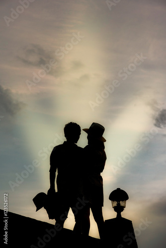 couple in love silhouette on sky background