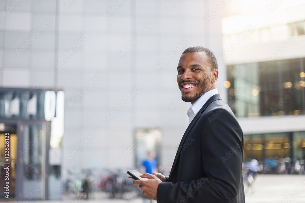 Portrait of smiling businessman with mini tablet Portrait of smiling businessman with mini tablet