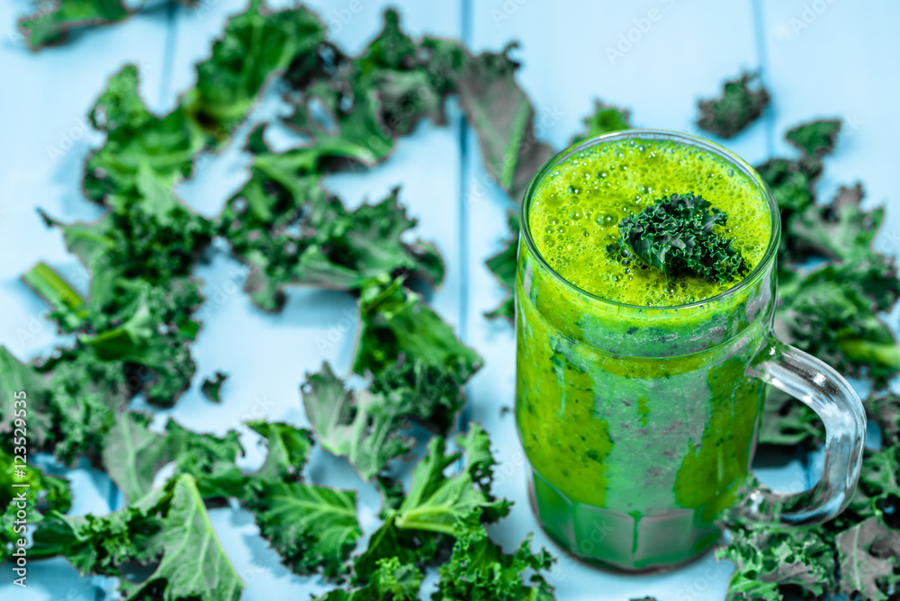 Green vegetable smoothie with blended leaves in jar mug Green vegetable smoothie with blended leaves in jar mug