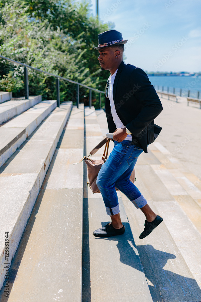 Young Fashionable Businessman Heading To Work . Manhattan Background New York City Young Fashionable Businessman Heading To Work . Manhattan Background New York City