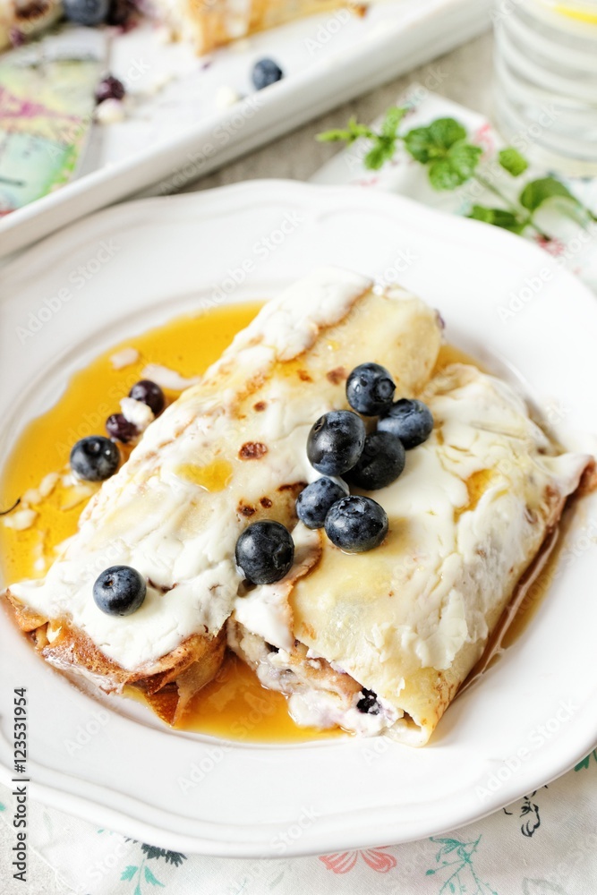 Baked crepes with cheese maple syrup and blueberries Baked crepes with cheese maple syrup and blueberries