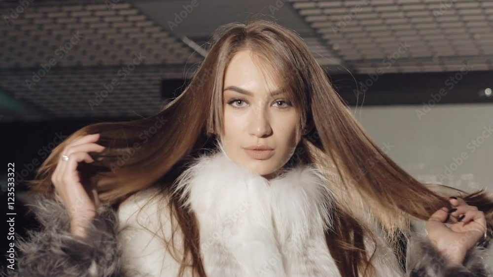 Closeup of sexy women flirting seductive in rich fur coats. Slowly Closeup of sexy women flirting seductive in rich fur coats. Slowly