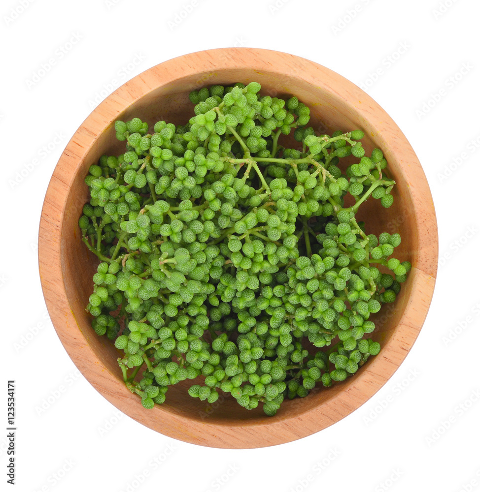 top view of Fresh Zanthozylum limonella Alston in wooden bowl is top view of Fresh Zanthozylum limonella Alston in wooden bowl is