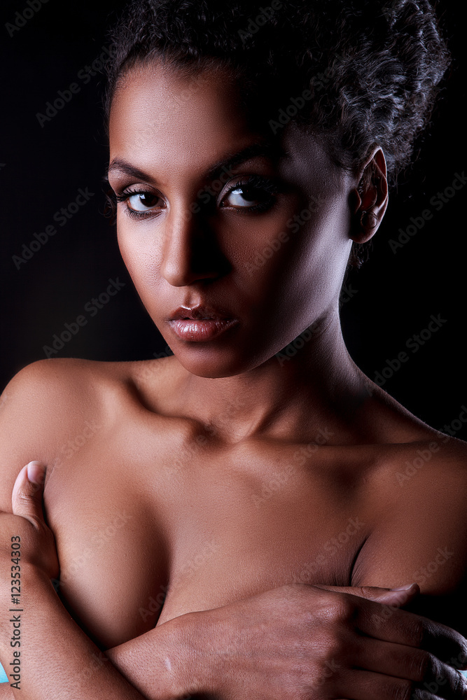 Portrait of beautiful dark-skinned Nude girl