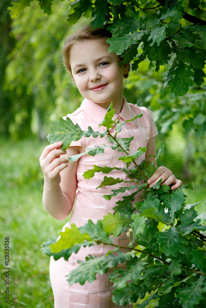 Portrait of beautiful little girl in forest Park Portrait of beautiful little girl in forest Park