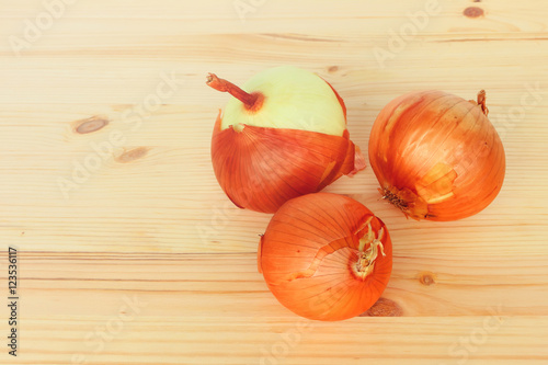 Onions on the wood. Toned colors 