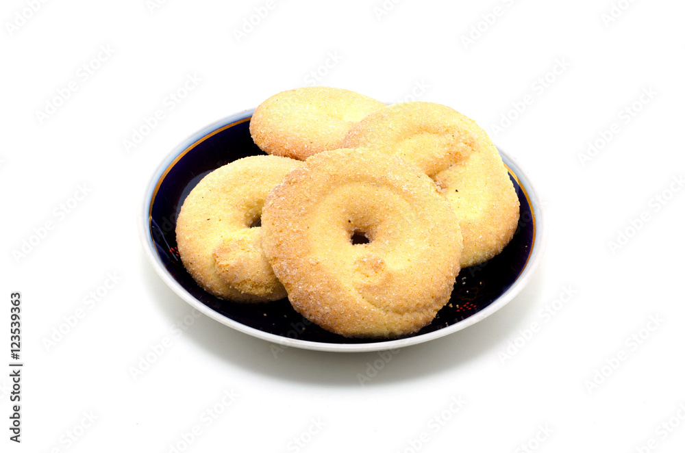 Sugar Cookies in a saucer on a white background.