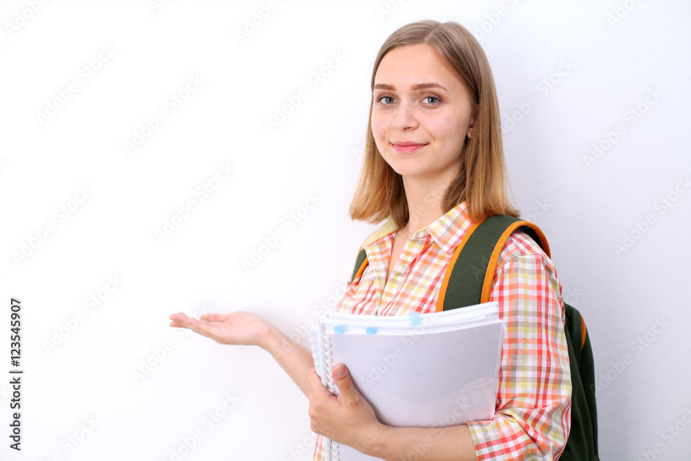 Happy young student girl holding books, study, education, knowledge, goal concept Happy young student girl holding books, study, education, knowledge, goal concept