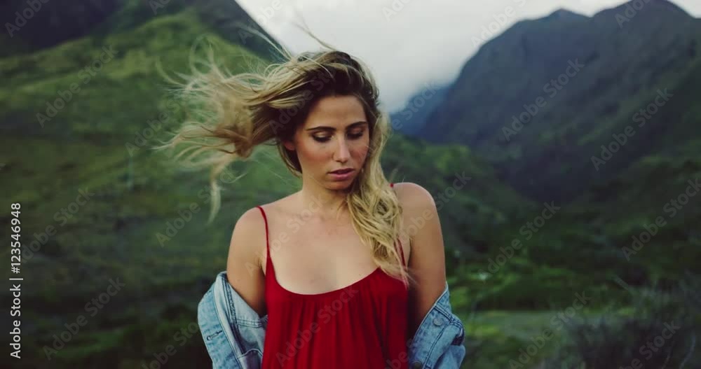Beautiful carefree young woman with hair blowing in the wind, fashion lifestyle Beautiful carefree young woman with hair blowing in the wind, fashion lifestyle