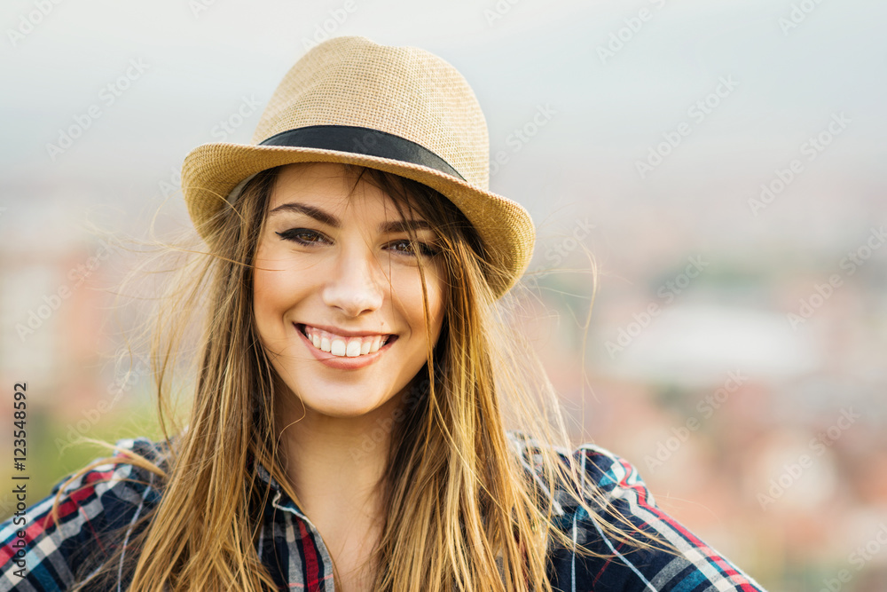 Beautiful young blonde woman in autumn smiling