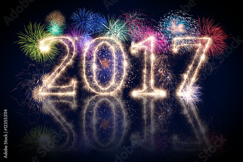 happy new year 2017 sparkler background with fireworks and spark pyro number photo