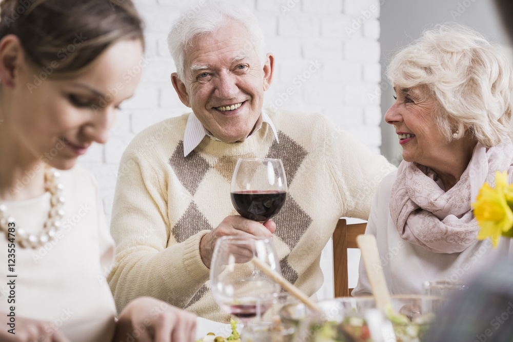 Man holding a glass of wine Man holding a glass of wine