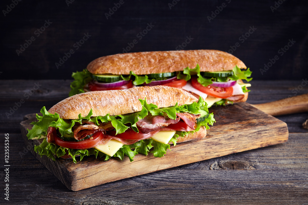 Valokuva Two fresh submarine sandwiches - tilaa netistä Europosters.fi