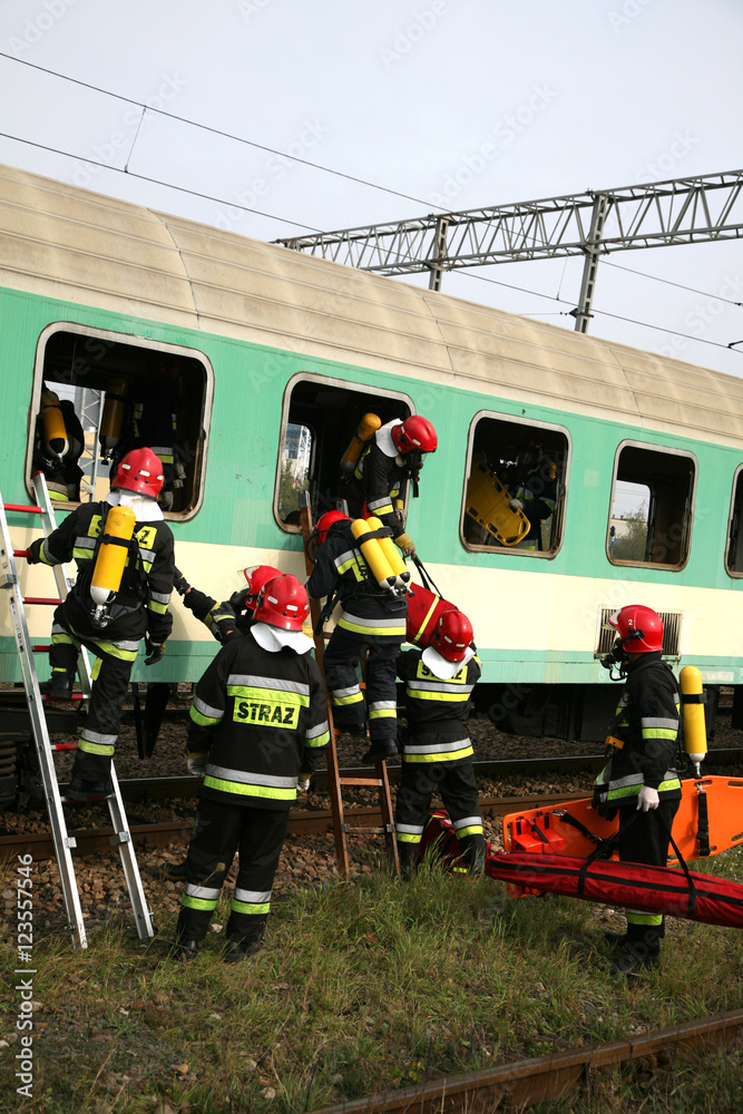 Naklejka premium firemen in action, Firefighters exercises train accident, chemical contamination