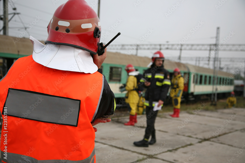 Fototapeta premium firemen in action, Firefighters exercises train accident, chemical contamination 