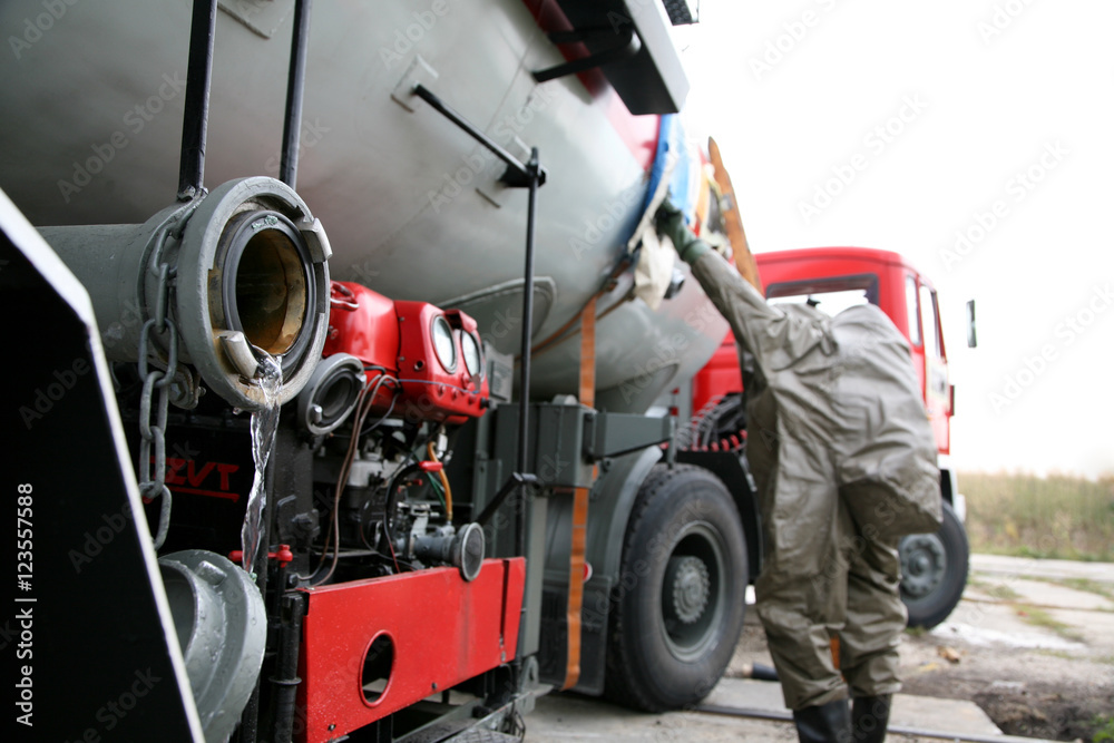 Fototapeta premium firemen in action, Firefighters exercises train accident, chemical contamination