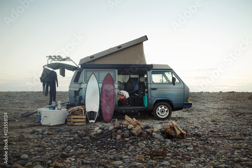 Camping equipment on beach against sky photo