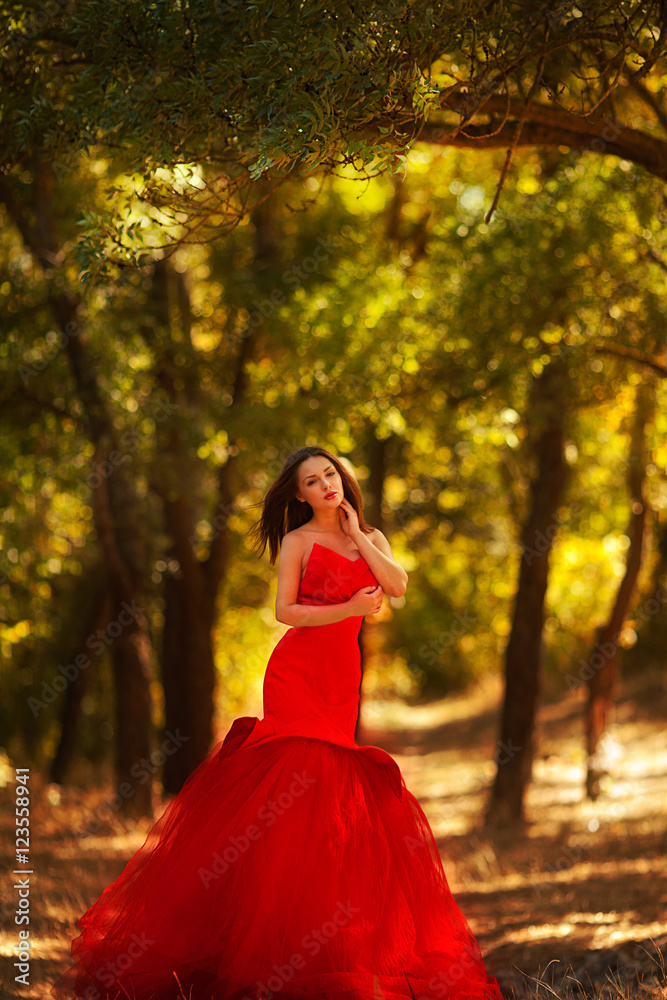 beautiful girl in the autumn forest in red dress beautiful girl in the autumn forest in red dress