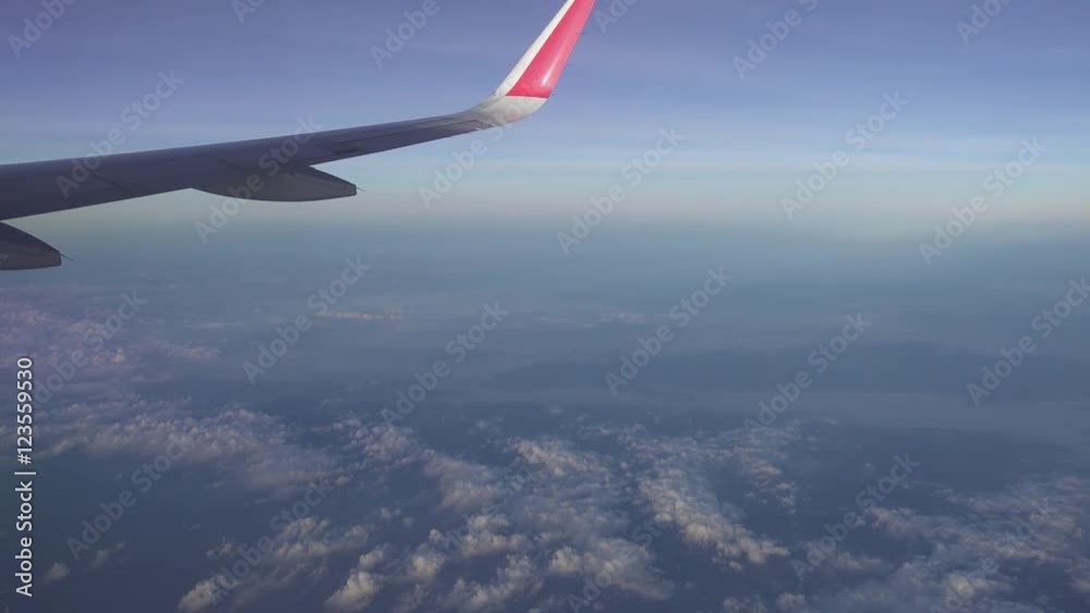 looking on wing and sky from airplane 4k
looking on wing and sky from airplane 4k