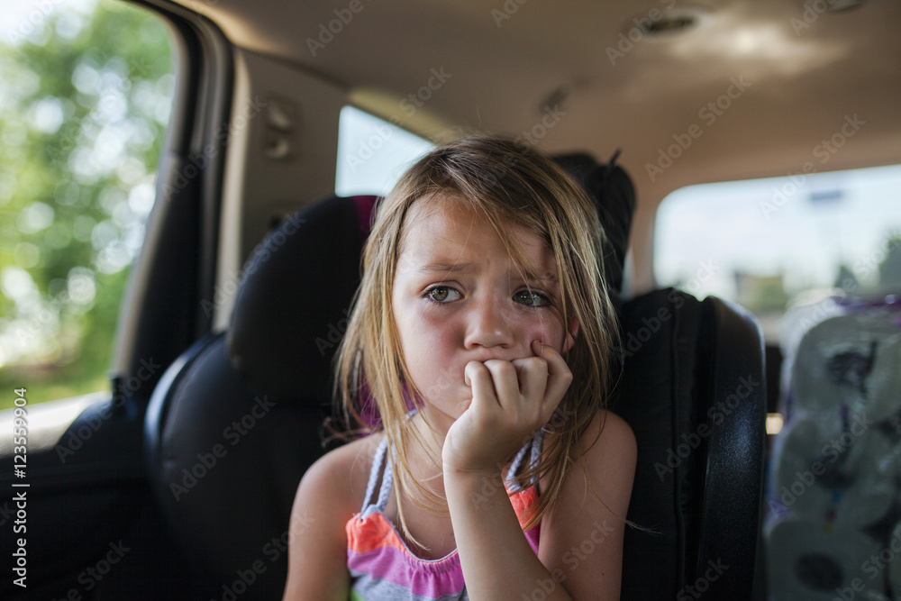 Upset girl looking away while sitting in car Upset girl looking away while sitting in car